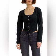 The Levi's Womens Daryn Long Sleeve Corset Blouse Is A Must-Have For Fashion-Forward Women Who Appreciate Timeless Style With A Modern Twist. Framing A Chic Scoop Neckline, This Corset-Style Top Brings A Graceful Element To Your Outfit. Its Long Sleeves Add A Subtle Yet Flattering Touch And Are Adorned With Three-Buttoned Cuffs. Button-Front Closure. 100% Cotton. Machine Washable. Imported. Levi's Tops With Button Closure For Spring, Fitted Levi's Cotton Top, Fitted Buttoned Tops For Fall, Fitted Tops With Buttons For Fall, Levi's Fitted Blouse For Spring, Fitted Levi's Blouse For Spring, Levi's Black Long Sleeve Tops, Levi's Fitted Casual Blouse, Levi's Fall Blouse