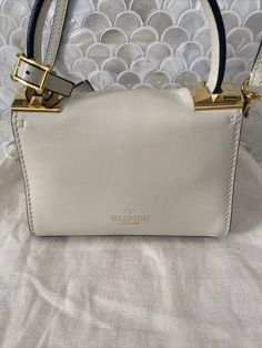 Valentino Garavani Rockstud Mini Ivory Tan Leather Top Handle Shoulder Bag | eBay White Top Handle Shoulder Bag With Metal Hardware, Designer Cream Bag With Silver-tone Hardware, White Leather Bag With Metal Hardware, Luxury White Satchel With Metal Hardware, Designer White Bags With Metal Hardware, Designer Cream Bag With Metal Hardware, Designer Cream Shoulder Bag With Adjustable Strap, White Leather Satchel With Metal Hardware, Cream Leather Shoulder Bag With Metal Hardware