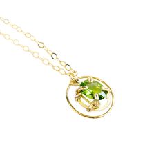 A unique pendant with a bright, clear genuine oval peridot gemstone. The beautiful lime-green color of this peridot sparkles brightly in the light! The gemstone "floats" in a gold circle ring for a distinct look.MATERIALGold filled chainGold filled wireGenuine gemstone SIZE20mm circle ring18" chain11x9mm peridot CLOSURELobster claspWHAT IS FILLED GOLD?We used to have just 2 choices: pure gold or gold plate. The first was very expensive and the second was…well…not very good.Our gold filled jewelr Modern Gold Jewelry With Peridot, Lime Green Oval Jewelry For May Birthstone, Modern Gold Peridot Jewelry, Oval Peridot Green Jewelry, Oval Green Peridot Necklaces, Oval Green Peridot Jewelry, Green Oval Peridot Jewelry, Modern Green Peridot Jewelry, Modern Green Round Pendant Jewelry