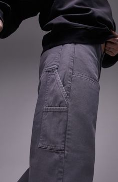 Carpenter pockets and panels distinguish these relaxed pants cut from nonstretch denim. 6" leg opening; 11 1/2" front rise; 15 1/2" back rise (size 32x32) Zip fly with button closure Five-pocket style 100% cotton Machine wash, line dry Imported Denim Blue Cropped Pants With Side Pockets, Cropped Denim Blue Pants With Side Pockets, Denim Blue Tapered Leg Cargo Pants, Streetwear Cargo Pants With Welt Pockets And Straight Leg, Loosely Fitted Cargo Jeans With Tapered Leg, Streetwear Bottoms With Welt Pockets And Straight Hem, Utility Style Wide Leg Washed Black Pants, Tapered Leg Denim Blue Pants With Pockets, Washed Black Wide Leg Utility Pants