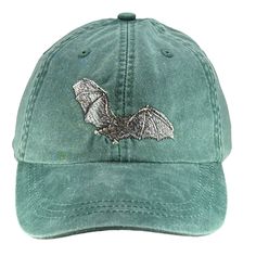 Bat embroidered on a pigment dyed cap in choice of color. Shown on pink and nautical red Colors may not look the same on all monitors Adams brand 100% garment-washed cotton twill 6-panel, unstructured, low-profile tuck-away back leather strap with antiqued brass buckle and grommet adjustable.  fits most men and women Cool-Crown™ mesh lining four rows of stitching on bill Garment washed, pigment dyed gives the cap a nice faded look Caps made in china-embroidery done in USA Casual Halloween Baseball Cap With Curved Brim, Casual Adjustable Baseball Cap For Halloween, China Embroidery, Halloween Hat, Fruit Bat, Hat Fits, Halloween Hats, Hat Baseball, Brass Buckle