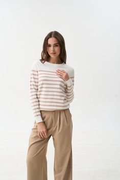 This trendy striped sweater in beige and white is a must-have for the new season. The neutral beige color can be harmoniously combined with various shades of blue denim, caramel, brown, and gray. The simple design makes it easy to pair the sweater with jeans, pants, and skirts of different styles. Our favorite choice is a cozy look with a blue denim palazzo and cowboy boots. Casual Taupe Sweater For Spring, White Cotton Sweater With Horizontal Stripes, Chic White Sweater With Contrast Stripes, Casual Neutral Sweater For Work, Striped Sweater For Everyday In Fall, White Sweater With Contrast Stripes For Spring, White Striped Sweater For Spring, Trendy Neutral Spring Sweater, Everyday Beige Fine Knit Sweater