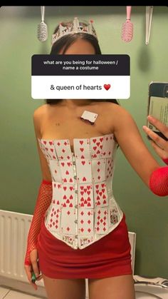 a woman wearing a corset and holding a cell phone