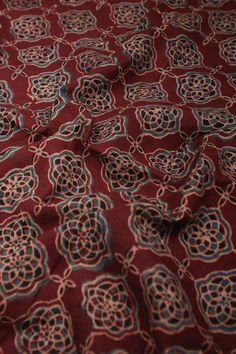 an image of a red and blue fabric with circles on it's surface,