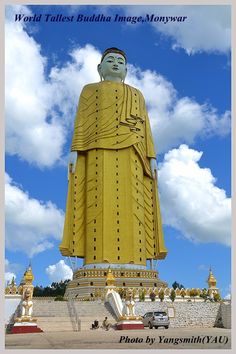 the giant buddha statue is in front of some clouds