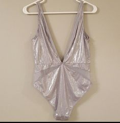 Nwt Victoria's Secret New Shine Collection Silver Satin & Mesh Long V-Neck Open Back, Size Large(Runs Small) Beautiful Lingerie!!! My Price Is Firm. I Offer A 25% Discount Off Of Two Of My Listings, Other Than That My Prices Are Very Firm. Thank You Kindly!!! Summer Club Bodysuit In Silver, Silver Bodysuit For Night Out In Summer, Silver Bodysuit For Summer Parties, Victoria's Secret Stretch Swimwear For Parties, Victoria's Secret Sleeveless Party Swimwear, Victoria's Secret Party Swimwear, Chic Victoria's Secret Swimwear For Party, Chic Party Swimwear By Victoria's Secret, Fitted Low-cut Party Swimwear