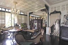 an ornately decorated living room with chandelier