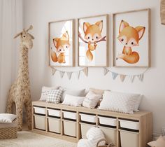 a baby's room decorated in neutral tones with pictures and toys on the wall