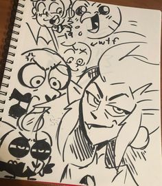 a drawing of some cartoon characters on a piece of paper with black marker and red pen