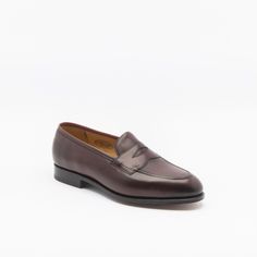 Burgundy antique calf penny loafer with single leather sole. Fitting F, last 184. Made in England Classic Moccasins With Rubber Sole For Galas, Classic Brogue Moccasins For Galas, Classic Italian Moccasins For Semi-formal Occasions, Classic Moccasins With Brogue Detailing For Galas, Classic Brogue-detailed Moccasins For Galas, Classic Italian Moccasins With Almond Toe, Classic Cap Toe Loafers For Galas, Classic Cap Toe Loafers With Leather Sole, Vintage Leather Sole Moccasins For Business