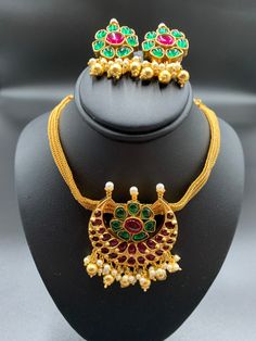 Traditional Ruby & Emerald Stones with Pearls chocker necklace with matching earrings Handmade jewelry One gram gold jewelry Silver plated jewelry Official Website globusfashions.com 🌸 S H O P . M O R E . S T Y L E S 🌸 https://www.etsy.com/shop/Globusfashions Necklaces - https://www.etsy.com/shop/Globusfashions?section_id=18712263 Bracelets - https://www.etsy.com/shop/Globusfashions?section_id=18969767 Pendant Sets - https://www.etsy.com/shop/Globusfashions?section_id=18707402 Tikka - http Gold Plated Temple Jewelry With Matching Earrings, Traditional Gold Necklaces With Matching Earrings, Temple Jewelry Style Gold Plated Jewelry Sets For Celebration, Temple Jewelry Sets With Matching Earrings, Temple Jewelry Sets With Matching Pendant Earrings, Gold Jewelry Sets With Matching Earrings For Celebration, Gold Plated Temple Jewelry Sets For Celebration, Gold Hallmarked Chandbali Jewelry, Temple Style Gold Plated Jewelry Sets For Celebration