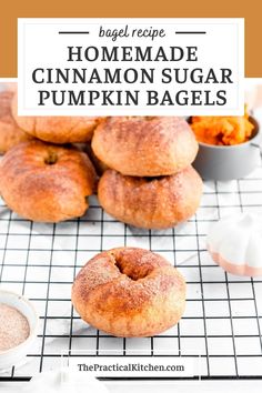 homemade cinnamon sugar pumpkin bagels are stacked on a cooling rack with the title above it