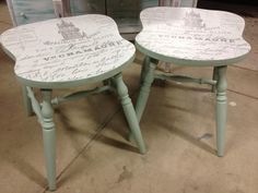 two tables with writing on them sitting next to each other