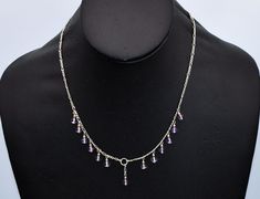 "This amethyst 925 silver princess bib from the 70's is a dainty sterling & purple bead dangles figaro chain necklace.  It measures 17 1/4\" (43.815 cm) end to end. The bib is 5 1/8\" (13.0175 cm) wide, by 3/16\" (0.47625 cm) long. Total weight is 6.6 grams. It is in excellent vintage condition. It has an ethereal airy design and is nicely made. This charming vintage bib necklace is fit for a princess." Silver Figaro Chain, Bead Dangles, Princess Necklace, Figaro Chain Necklace, Figaro Chains, Bib Necklaces, Figaro Chain, Purple Gray, Bib Necklace