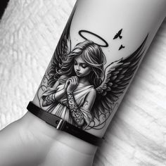 a woman with an angel tattoo on her arm