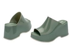 Throwback style meets current trends—that’s just how the Patty rolls. Lightweight and streamlined with a wide strap and a peep toe, these platform mules are true attention seekers, and the contrasting sole detail amps up the cool factor. Made from our revolutionary Melflex® PVC plastic, you enjoy more flexibility and comfort. Plus, they’re 100% recyclable. Trendy Platform Slip-on Slides, Modern Platform Slip-on Slides, Chunky Platform Slip-on Slides For Spring, Spring Chunky Platform Slip-on Slides, Chunky Platform Slides For Spring, Modern Chunky Platform Slide Sandals, Trendy Slides With Cushioned Footbed And Open Heel, Modern Open Toe Platform Slides, Modern Platform Slides With Open Toe