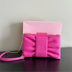 Selling A Cute New With Tags And Box Kate Spade Hot Pink Leather Bow Bag. This Is An Adorable Cross Body Bag Style Name Is Millie And The Color Is Magenta Lipstick Pink. The Chain Is Gold And Has A Leather Strap At The Top For Comfort. The Bag Is Brand New With Tags And Will Come With The Box Hot Pink Crossbody Bag, Pink Evening Pouch Shoulder Bag, Kate Spade Pink Bags For Evening, Pink Pouch Clutch With Detachable Strap, Pink Kate Spade Bag For Evening, Pink Clutch Shoulder Bag With Dust Bag, Pink Clutch With Detachable Strap For Shopping, Pink Leather Crossbody Clutch, Pink Kate Spade Evening Bag