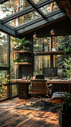 a home office with glass walls and lots of plants in the window sill area