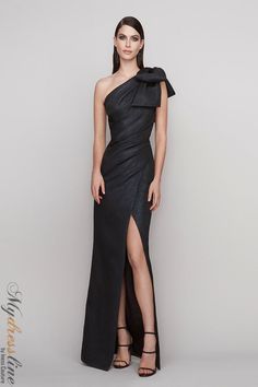 Looking for a show-stopping gown that will turn heads? The Frascara 4142 is perfect for making a statement. This one shoulder gown features a draped bodice with a large bow on the shoulder, fit and flare silhouette, and front side slit. Plus, it has a hidden back zipper and is satin lined for a luxurious feel. Made from 54% polyester, 23% cotton, 11% viscose, 10% polymetallic, and 2% other fibers, this gown is sure to make you look and feel your best. High Tea Dress, Cotillion Dresses, Wedding Frocks, Morristown Nj, Gala Outfit, Mother Of The Bride Gown, Greenville Sc, Black Gown, Gowns Of Elegance