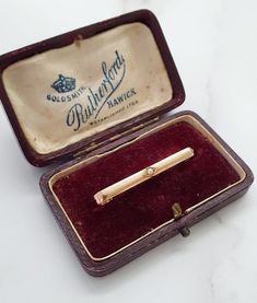 Antique 9ct Gold & Seed Pearl Bar Brooch.This is yellow gold, however the gold has a lovely warm rose tint to it. Common for items made around this period.Hallmarked 9ct Gold. No date circa early 1900'sWeight: 2.5gDimensions: 38mm x 3.5mmSeed Pearl: 2mmCondition:  Good, clean antique condition. Pin & Clasp is full working order. All items have a full professional clean and polish upon dispatch. Please message for further information, photos, videos etc. Box pictured for display purposes Classic Engraved Yellow Gold Brooch, Classic Engraved Yellow Gold Brooches, Classic 14k Gold Brooches For Gift, Classic 14k Gold Brooches As Gift, Hallmarked 14k Gold Brooch For Formal Occasions, Formal Hallmarked 14k Gold Brooches, Classic Yellow Gold Brooches For Wedding, 14k Gold Hallmarked Brooches For Anniversary, Classic Yellow Gold Wedding Brooches