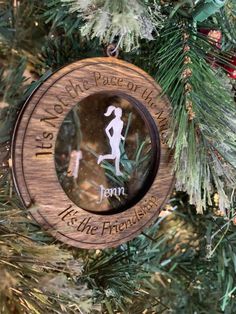 a wooden ornament hanging on a christmas tree that says, it's the place