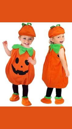 two children dressed up in pumpkin costumes