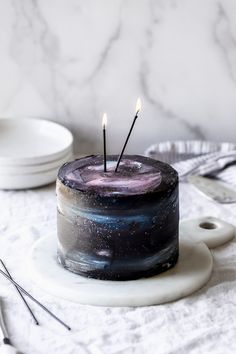 there is a cake with two candles on it