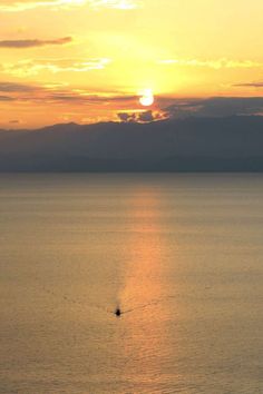 Boat Ride on Lake Kivu in western Rwanda. Lake Kivu is the largest lake in Rwanda and a great vacation spot thanks to its tropical climate, beaches and rolling hills. Sunset Boat Ride, Sunset Over Lake, Great Vacation Spots, The Great Lakes, Boat Ride, Tropical Climate, Off The Beaten Path