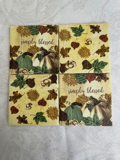 four coasters with autumn leaves on them