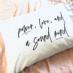 a pillow that has some writing on it