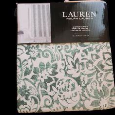 the packaging for lauren lauren's green and white floral print bedding set is shown