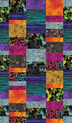 a patchwork quilt with different colors and patterns