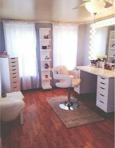 a living room with hardwood floors and white furniture