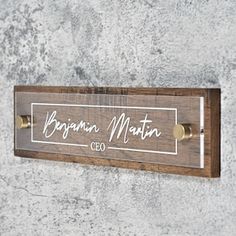 a wooden sign hanging on the side of a wall that says organic matter co in white lettering