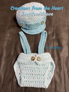 two crocheted purses are sitting on a bed with the words creations from the heart underneath them