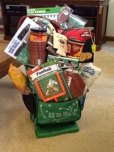 a football themed gift basket on the floor