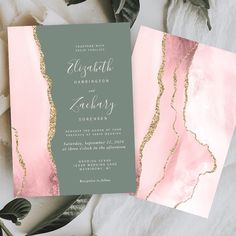 pink and green wedding stationery with gold foil on the front, along with greenery