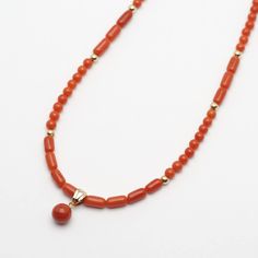 Type of metal: Genuine 18K gold Necklace full length: 43cm/16.9 inches Beads size: 2-3.5mm Tube size: 3-4mm(width) Charm size: 6.3mm ※Size is approx. Type of coral: Natural Mediterranean coral (not dyed) Coral conditions: There's slight scratches & dents on the surface  【 All corals dealing in our shop are natural 】 Not dyed, Not treated, Not enhanced. Cut and polish only. Corals have natural scratches and dents and cracks. Please kindly note that as a natural proof.  If you have any questions about the product please feel free to contact us. Red Coral Single Strand Round Necklace, Hand-strung Red Coral Beaded Necklaces, Polished Red Coral Gold Beads, Coral Beads Necklace, Adjustable Hand-strung Red Coral Necklace, Red Coral Necklace, Multi-strand Red Coral Necklace With Polished Beads, 18k Gold Necklace, Coral Necklace