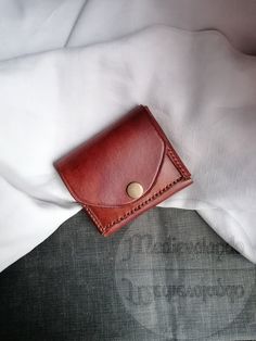 Made with top quality 100% Italian leather, hand-sewn with a resistant and repairable waxed thread, the leather is first colored by hand and then treated with a special cream that protects it and keeps it soft. Completely handmade. This mini wallet with a minimal, compact and slim design is perfect to keep in your pocket and is useful in all those situations where you need to have credit cards, documents and banknotes with you, but you don't have room for a normal wallet thick and chunky. The petite size and thinness makes it a perfect complement to the belt bags used by those who attend festivals, concerts or love bushcraft! Being able to insert it in pockets, even inside jackets, also allows you to avoid being robbed on public transport and when you are in areas crowded with people. It c Brown Leather Trifold Wallet Hand-stitched, Leather Trifold Coin Purse With Card Slots, Leather Card Holder With Waxed Finish As Gift, Leather Card Holder With Leather Lining For Gift, Hand-stitched Leather Trifold Wallet, Hand-stitched Leather Rectangular Coin Purse, Hand-stitched Brown Leather Wallet, Hand-stitched Rectangular Leather Coin Purse, Handmade Leather Bifold Bag