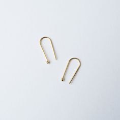 Arc gold horseshoe / arc shaped earrings. Simple, minimal gold vermeil arc earrings. Perfect for every day. The small sphere at the end measures 2mm wide and the earring drop is 18mm. Earrings are gold vermeil- 925 sterling silver gold plated. We also do a large version of this earring. Your earrings will arrive in recyclable packaging, in a nice lil branded box perfect for gifting. We always include our jewellery care card in your package. Please leave a note at check out for gift notes to the Minimalist Hypoallergenic Gold Ear Climbers, Minimalist Ear Climbers As Gift, Minimalist Ear Climbers As A Gift, Minimalist Ear Climbers With Ear Wire For Gift, Minimalist Brass Threader Earrings For Everyday, Minimalist Yellow Gold Wrap Earrings As Gift, Minimalist Gold Cartilage Earrings With Ear Wire, Minimalist Brass Wrap Earrings As Gift, Minimalist Brass Threader Earrings As Gift