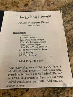 a menu for the lobby lounge in las vegas, nv on a marble counter top