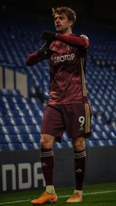 a man standing on top of a soccer field