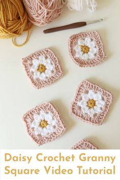 crocheted grannys are arranged on a table with yarn