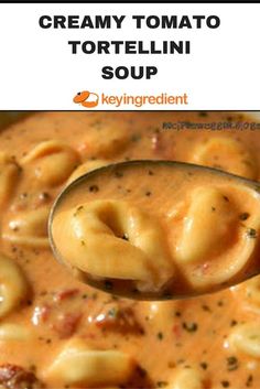 a spoon full of creamy tomato tortellini soup