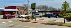 cars are stopped at an intersection in the city