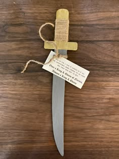 a knife with a note attached to it