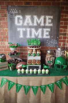 a football themed party with green and white desserts, snacks, and treats on a table