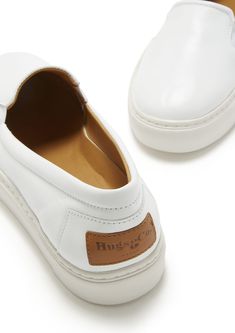 Slip-on contemporary style sneakers for women in white leather by Hugs & Co. Ultimately comfortable sneakers with a white leather upper and crisp white Vibram sole. Featuring our signature full leather lining for luxurious comfort and long lasting shape. Made in Portugal 100% Leather Upper featuring a 100% Leather Lining Rubber sneaker sole by Vibram White Classic Slip-on Sneakers With Round Toe, Classic White Slip-on Sneakers With Textured Sole, White Low-top Slip-on Sneakers With Removable Insole, White Classic Round Toe Slip-on Sneakers, Classic White Slip-on Sneakers With Round Toe, White Leather Slip-on Sneakers With Branded Insole, White Classic Slip-on Sneakers, White Slip-on Sneakers With Stitched Sole, White Leather Slip-on Sneakers With Round Toe