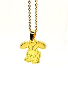 "26x26mm gold Mr Honeybunny pendant with 45cm (18\") lobster clasp gold chain.  S06E08 \"Lisa on Ice\" Bart: \"AT FIRST, I THOUGHT WE COULD TALK IT OVER LIKE CIVILIZED PEOPLE, BUT INSTEAD, I JUST RIPPED THE HEAD OFF MR. HONEYBUNNY.\" Lisa \"BART, THAT WAS YOUR CHERISHED CHILDHOOD TOY.\"" Gold Novelty Charm Necklaces For Gifts, Gold Novelty Charm Necklace For Gifts, Novelty Gold Pendant Jewelry, Yellow Charm Necklace With Lobster Clasp For Gift, Pendant Necklace Gold, Themed Jewelry, Childhood Toys, Gold Pendant Necklace, Rope Chain