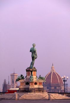 there is a statue on top of the building